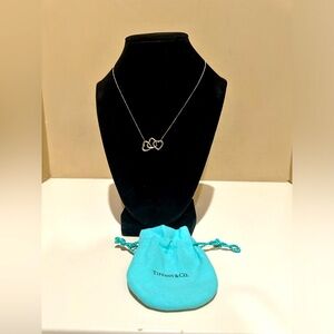 Tiffany & Co. Elsa Peretti Triple Open Hearts
Pendant Necklace